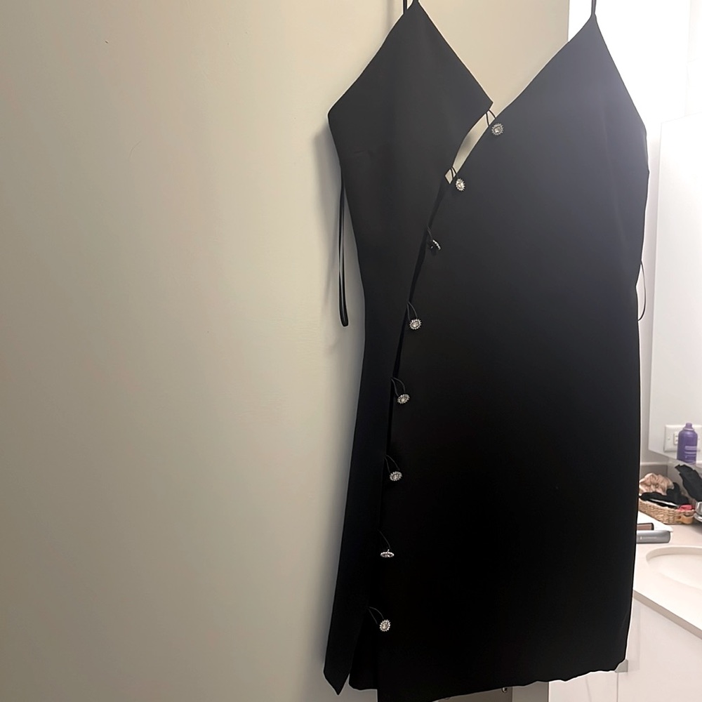 Black cocktail dress. Perfect for New Years Eve or any holiday celebration.